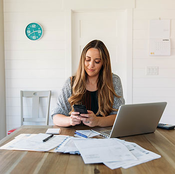  Young woman preparing taxes