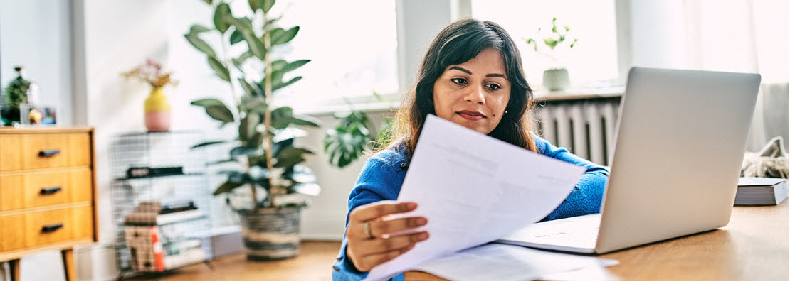woman looking at tax documents