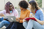 women sitting on steps talking
