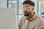 man in front of laptop