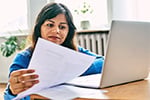 woman looking at a laptop