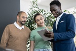 couple talking to car salesman