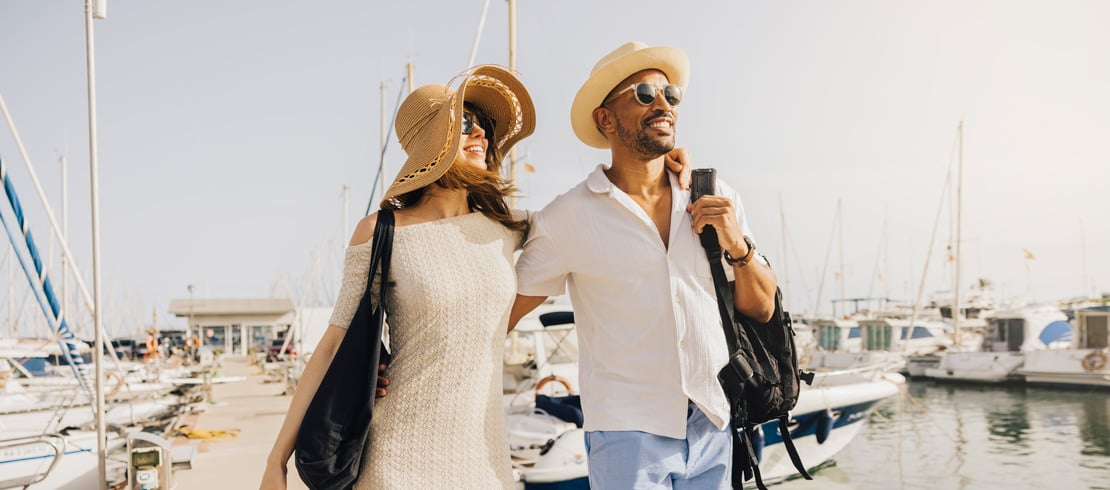 a couple smiling on a dock