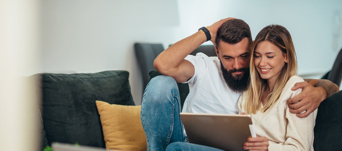 couple looking at a laptop together