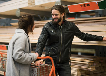 man and woman shopping for lumber