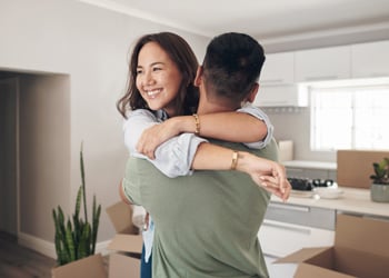 woman being held by man