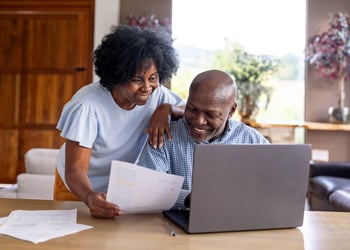 couple viewing laptop
