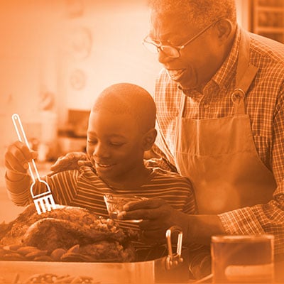 grandfather cooking with grandson
