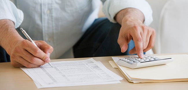 Man completing tax forms