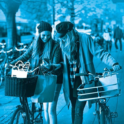 Two women looking at mobile phone