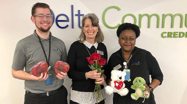 branch staff holding valentine's giveaways