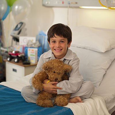 Smiling child with teddy bear