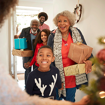 family holding presents