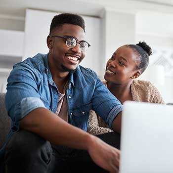 young couple looking at computer