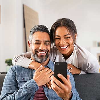 Young couple looking at phone