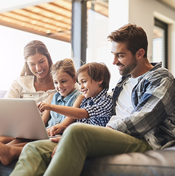 family sitting on couch