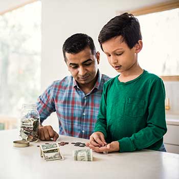 father and child counting money