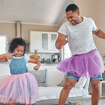 father and young daughter dancing