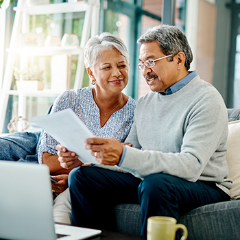 couple doing paperwork at computer