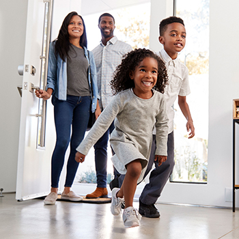 family entering new home