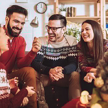 friends on couch talking and laughing