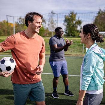 friends playing soccer