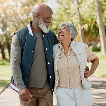 older copuple embracing and smiling