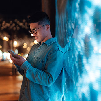 man looking at cell phone