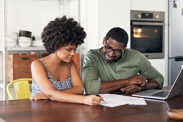 young couple looking at paperwork