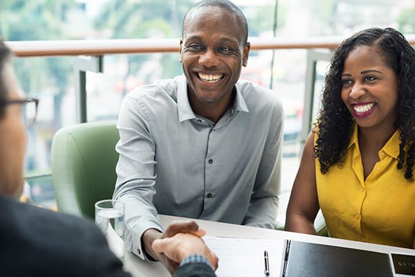 couple meeting with insurance agent