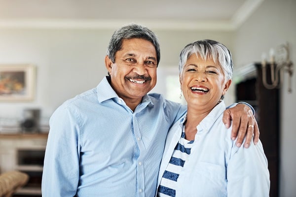 a mature couple smiling at camera