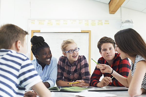 young students learning in classroom